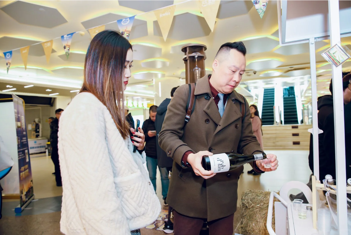 Shopper tasting Victorian wine at Freshippo